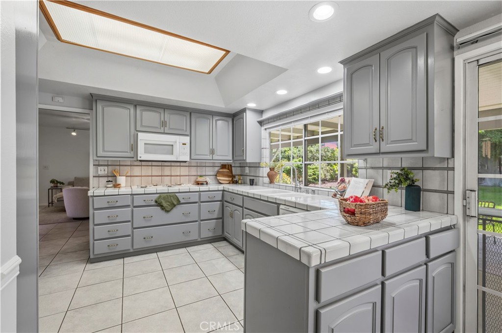 10741 Brookfield Road Chatsworth, CA 91311 - Photo 9 of 41 Kitchen looks out at beautiful backyard