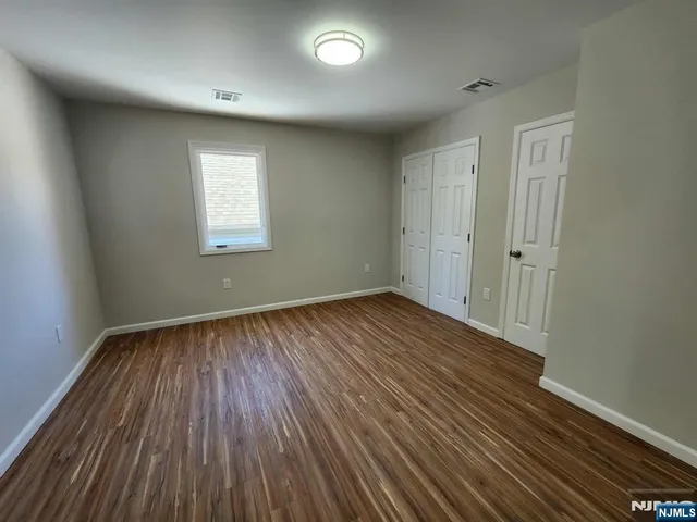 a kitchen with cabinets and white appliances