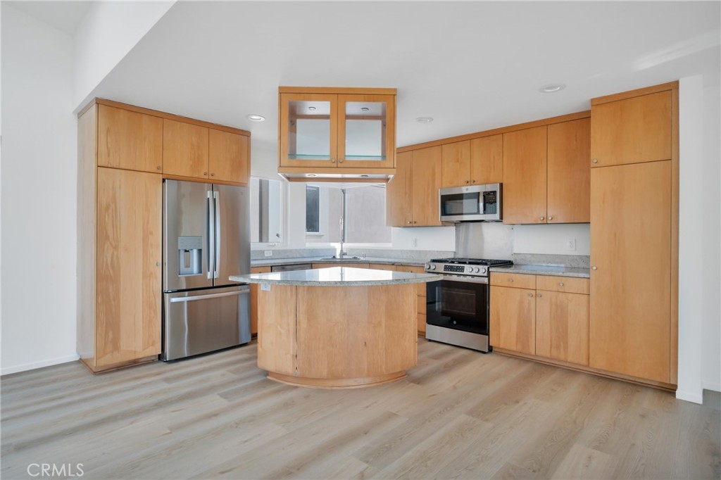 514 Ardmore Avenue Hermosa Beach, CA 90254 - Photo 13 of 54 a kitchen with stainless steel appliances granite countertop a stove a sink and a refrigerator