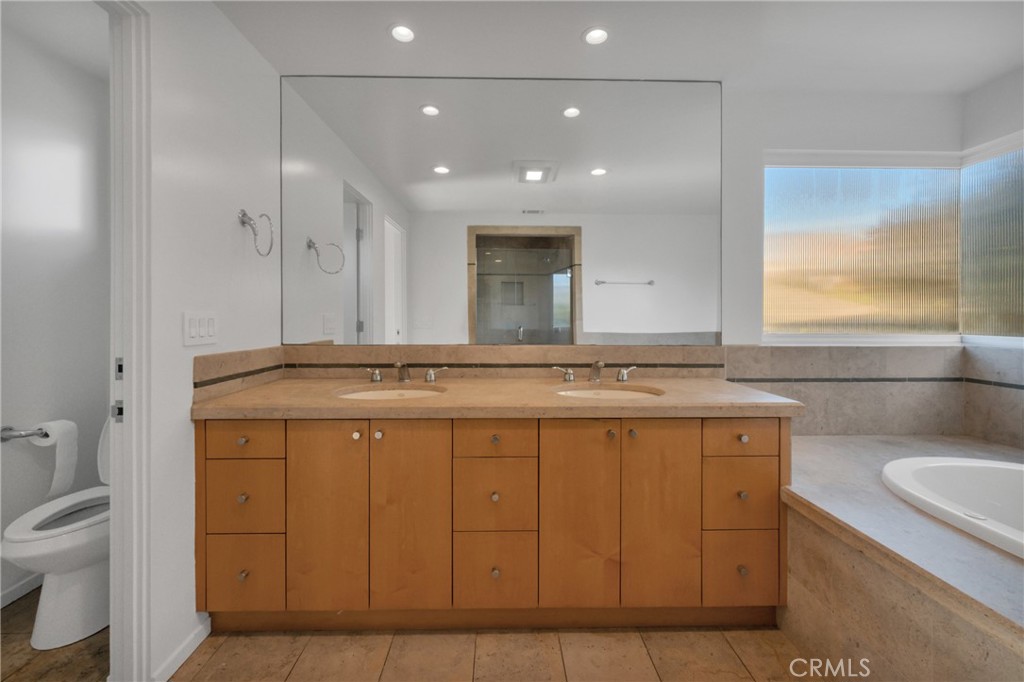 514 Ardmore Avenue Hermosa Beach, CA 90254 - Photo 22 of 54 a bathroom with a granite countertop sink a toilet and a shower