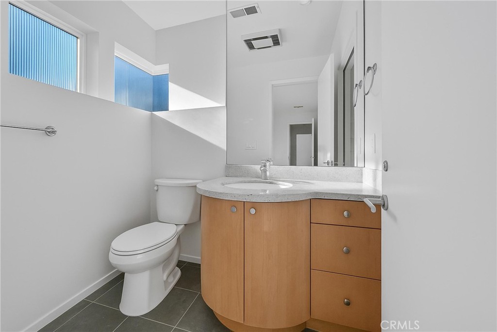 514 Ardmore Avenue Hermosa Beach, CA 90254 - Photo 36 of 54 a bathroom with a sink toilet and mirror