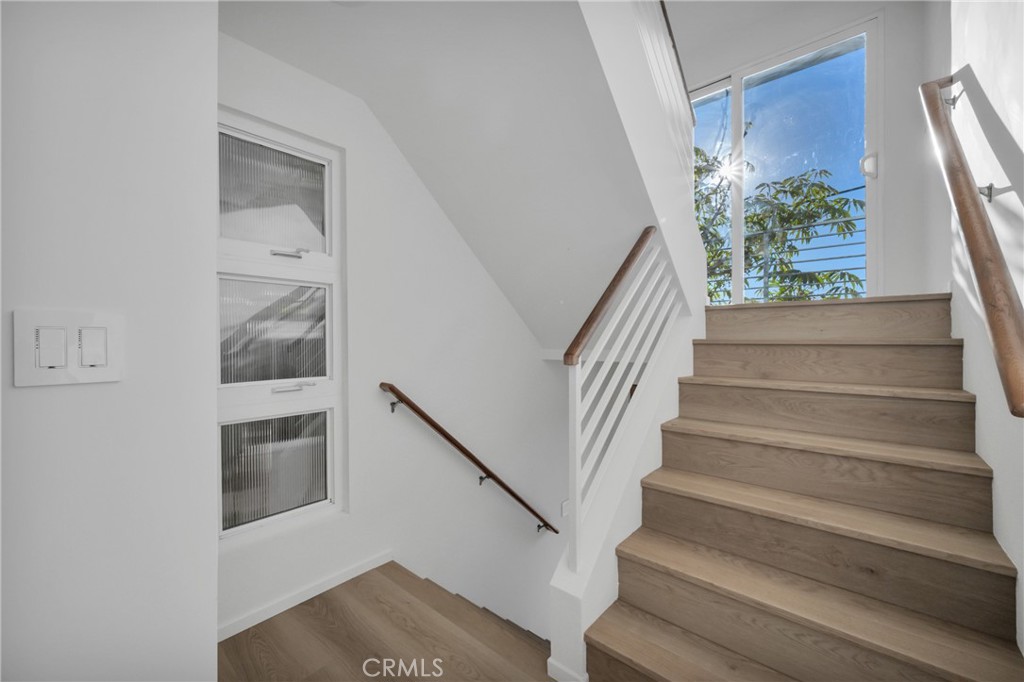 514 Ardmore Avenue Hermosa Beach, CA 90254 - Photo 38 of 54 a view of staircase with wooden floor and a potted plant