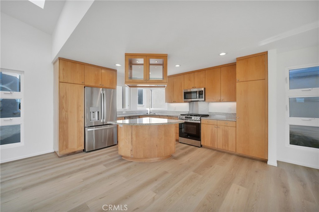 514 Ardmore Avenue Hermosa Beach, CA 90254 - Photo 10 of 54 a kitchen with stainless steel appliances a refrigerator and a stove top oven