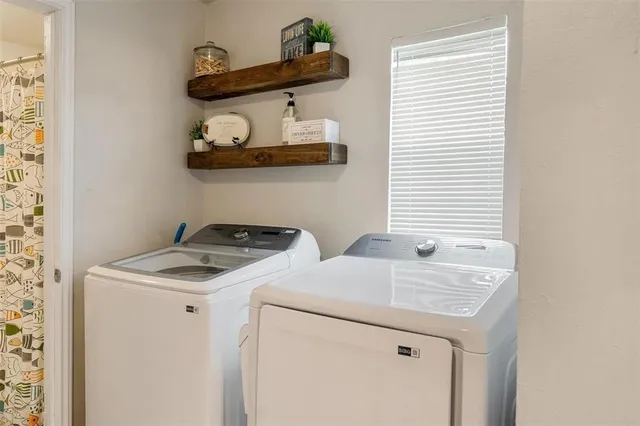 a utility room with dryer and washer