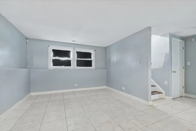 a view of an empty room with windows