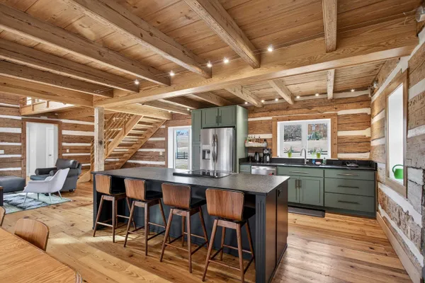 a kitchen with stainless steel appliances a refrigerator and a sink
