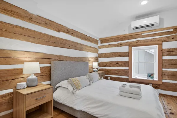 a bedroom with a bed and a table