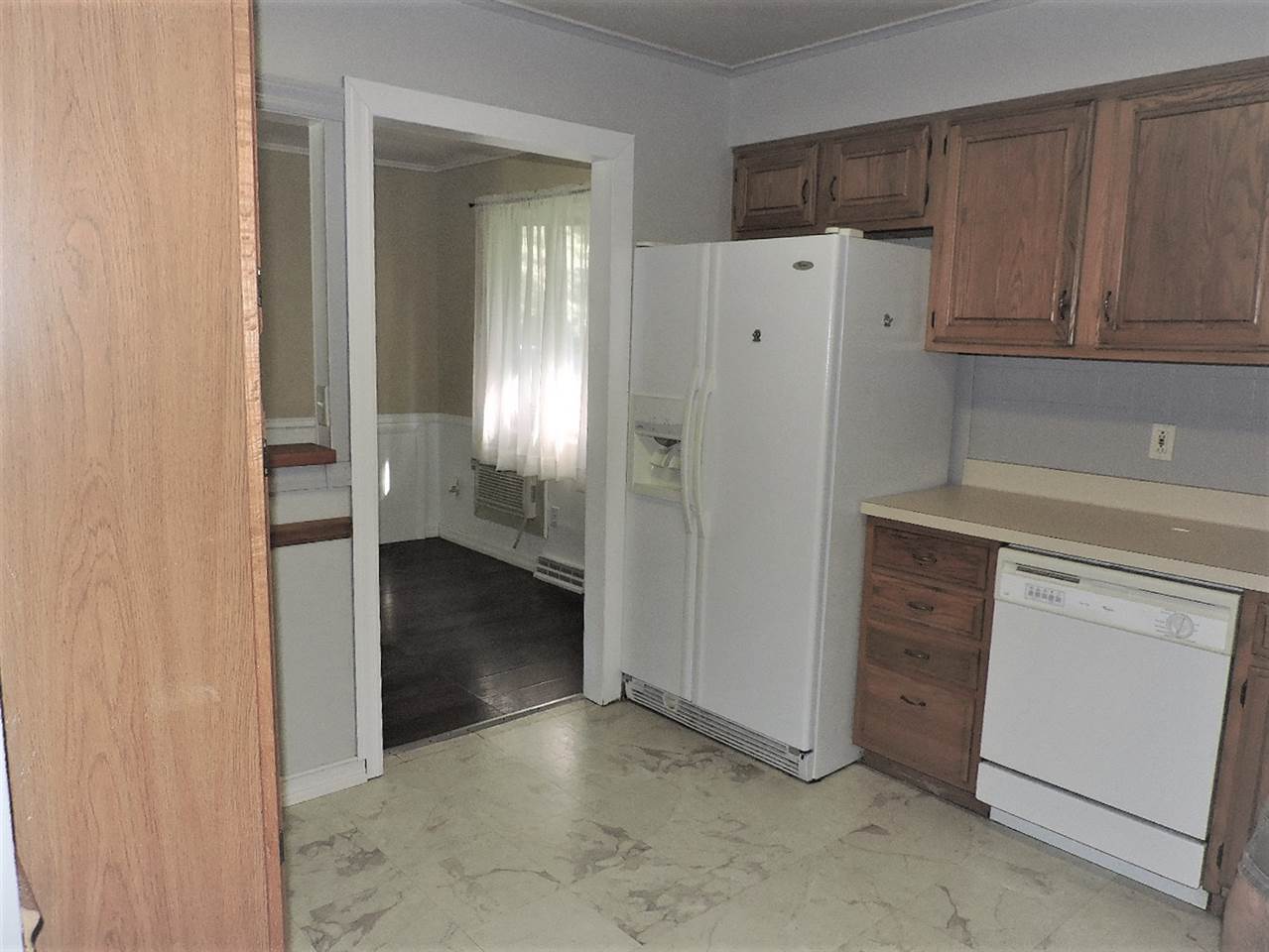 4219 Ostrander Road Rockford, IL 61107 - Photo 4 of 16 a view of a kitchen with refrigerator and cabinet