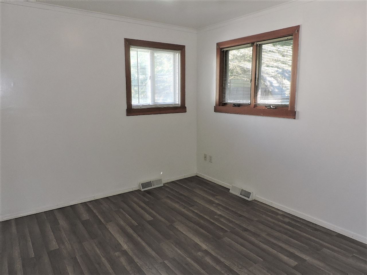 4219 Ostrander Road Rockford, IL 61107 - Photo 10 of 16 an empty room with windows