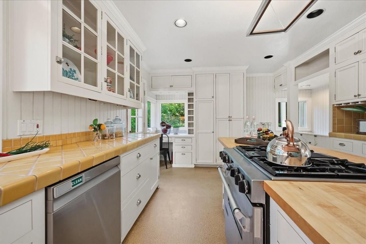 43120 Montgomery Avenue Davis, CA 95618 - Photo 12 of 52 a kitchen with a sink stove and cabinets