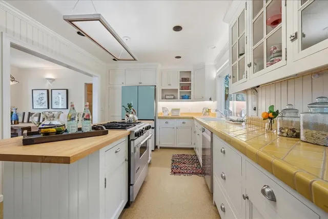 a kitchen with lots of counter top space and a sink