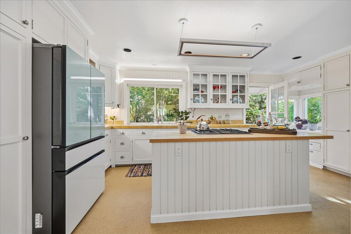 43120 Montgomery Avenue Davis, CA 95618 - Photo 14 of 52 a kitchen with stainless steel appliances granite countertop a stove and a refrigerator