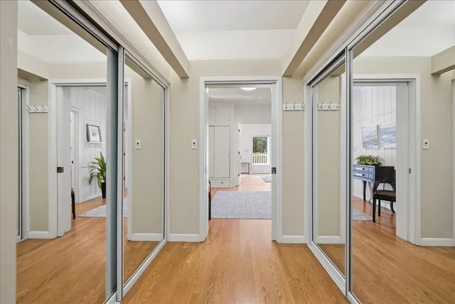 a bed room with a bed and a large window