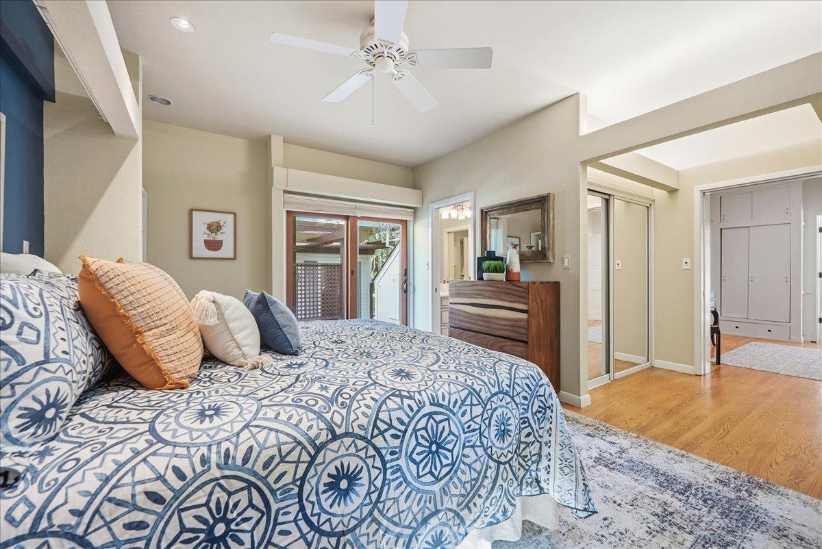 43120 Montgomery Avenue Davis, CA 95618 - Photo 23 of 52 a bedroom with a large bed and a chandelier