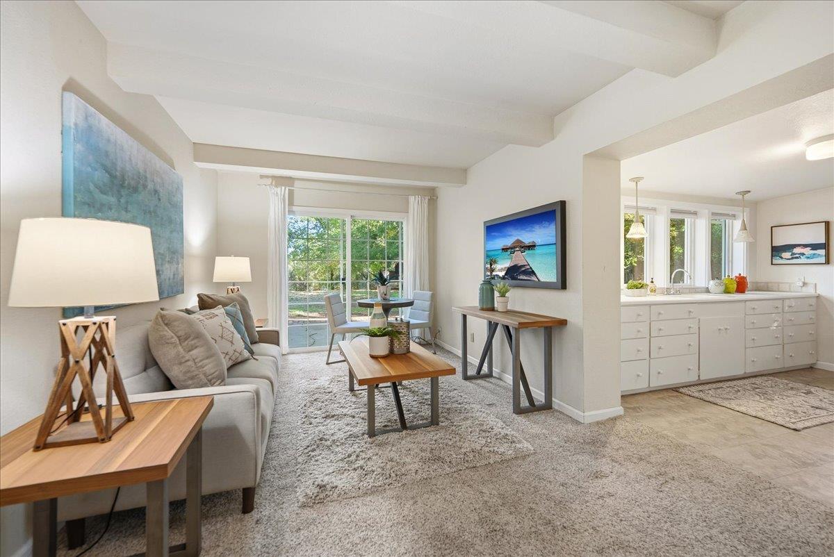 43120 Montgomery Avenue Davis, CA 95618 - Photo 31 of 52 a living room with furniture and a flat screen tv