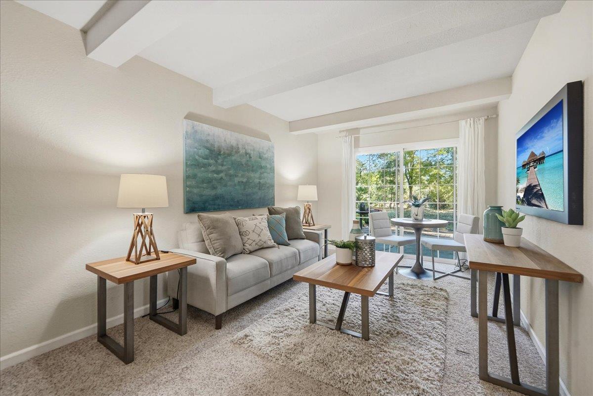 43120 Montgomery Avenue Davis, CA 95618 - Photo 32 of 52 a living room with furniture a window and a flat screen tv