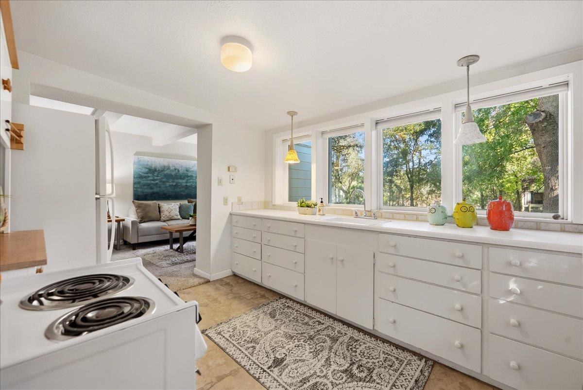 43120 Montgomery Avenue Davis, CA 95618 - Photo 35 of 52 a kitchen that has a sink and a stove