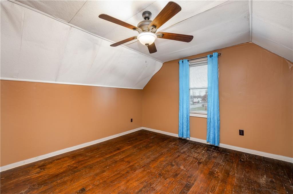 117 Freeport Road Butler, PA 16002 - Photo 16 of 25 an empty room with ceiling fan and wooden floor