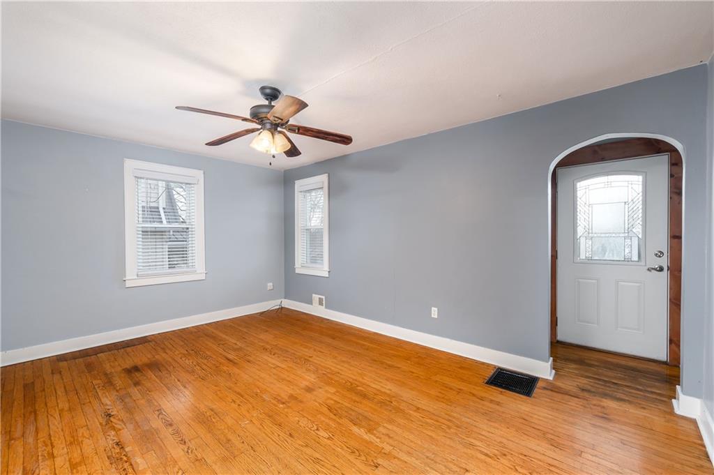 117 Freeport Road Butler, PA 16002 - Photo 5 of 25 wooden floor in an empty room with a window