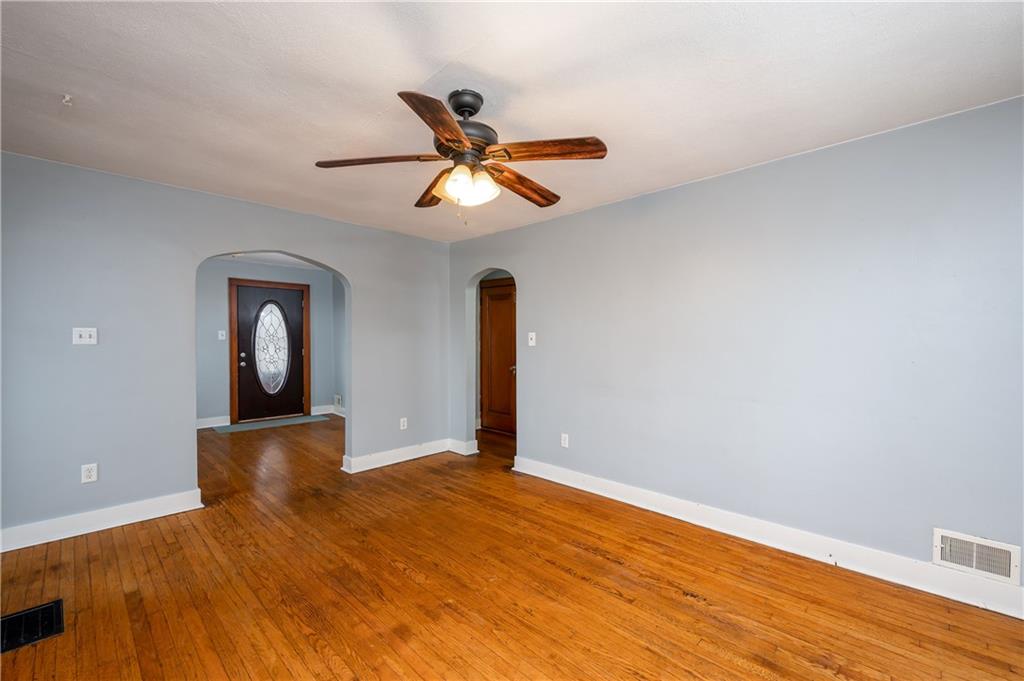 117 Freeport Road Butler, PA 16002 - Photo 6 of 25 a view of a room with wooden floor and white walls