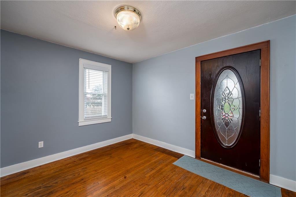 117 Freeport Road Butler, PA 16002 - Photo 7 of 25 a view of a livingroom with wooden floor and a window
