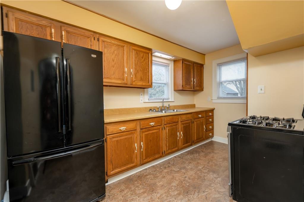 117 Freeport Road Butler, PA 16002 - Photo 9 of 25 a kitchen with a refrigerator and a sink