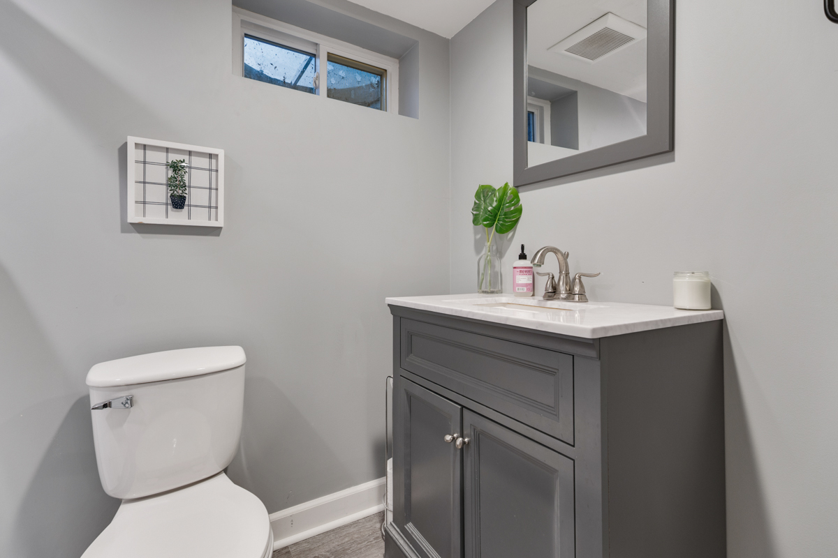 328 South 14th Street St. Charles, IL 60174 - Photo 16 of 20 a bathroom with a toilet a sink and mirror