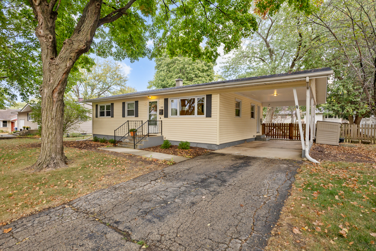 328 South 14th Street St. Charles, IL 60174 - Photo 2 of 20 a view of a yard with a house and a tree