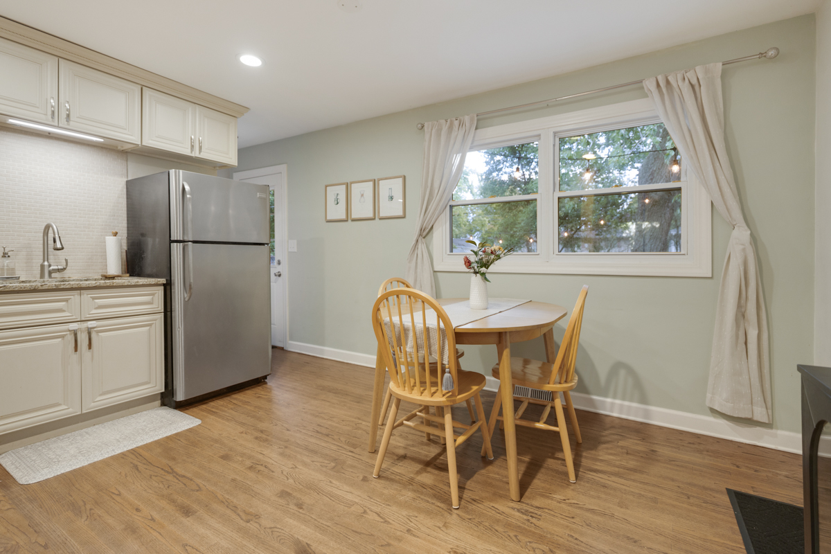 328 South 14th Street St. Charles, IL 60174 - Photo 5 of 20 a dining room with wooden floor and a window