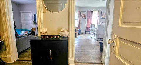 a kitchen with a refrigerator and a stove top oven