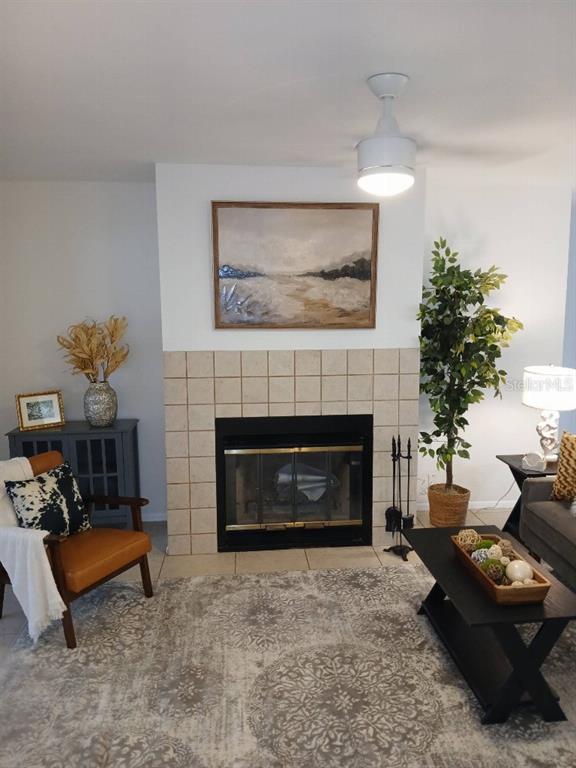 156 Devon Court Dunedin, FL 34698 - Photo 3 of 21 a living room with furniture and a fireplace