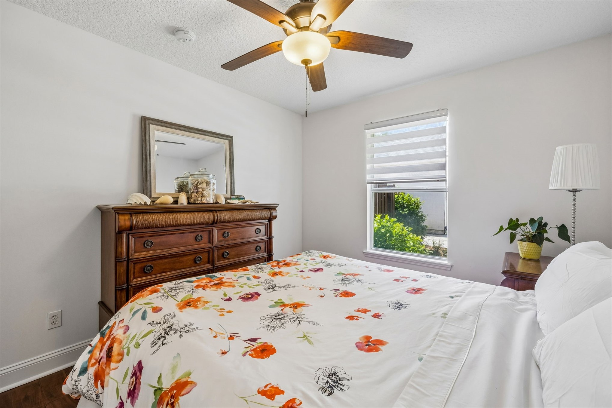 86107 Remsenburg Drive Fernandina Beach, FL 32034 - Photo 19 of 58 a bedroom with a bed and a dresser