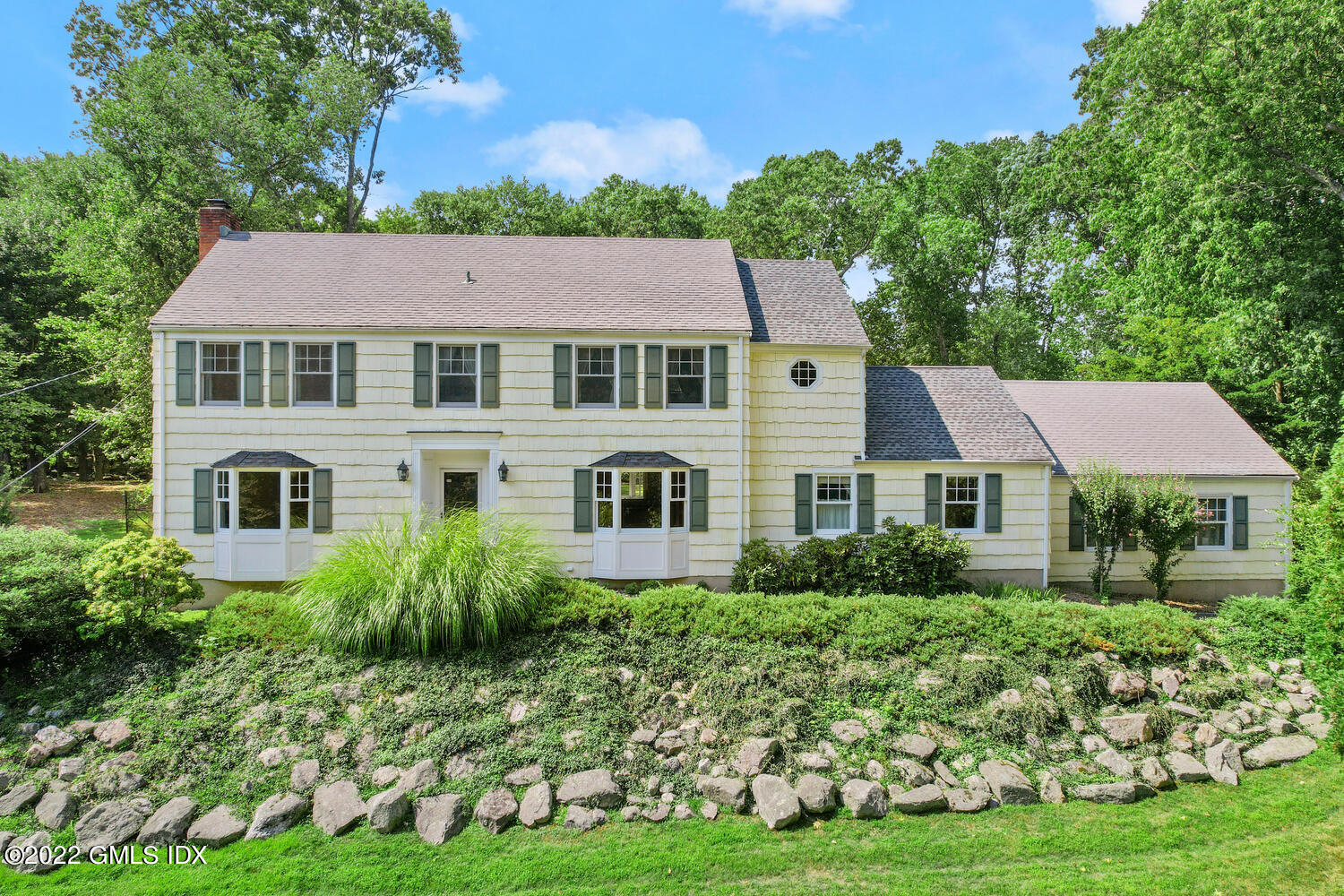 1 Sundance Drive Cos Cob, CT 06807 - Photo 1 of 50 a front view of a house with a yard