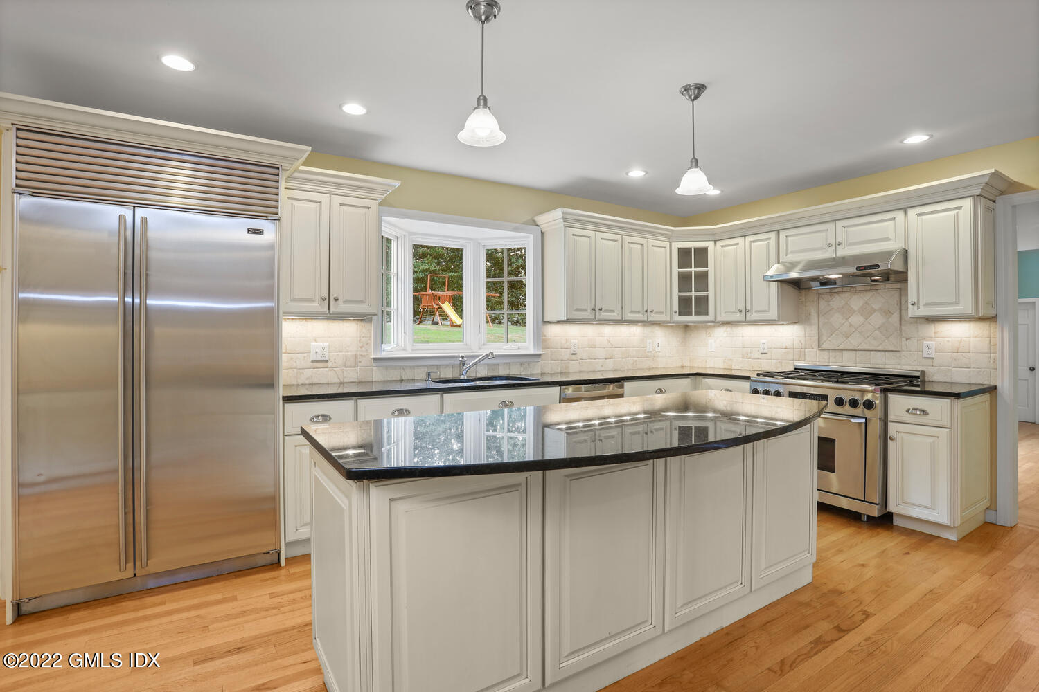 1 Sundance Drive Cos Cob, CT 06807 - Photo 12 of 50 a kitchen with stainless steel appliances granite countertop a sink a stove and a refrigerator