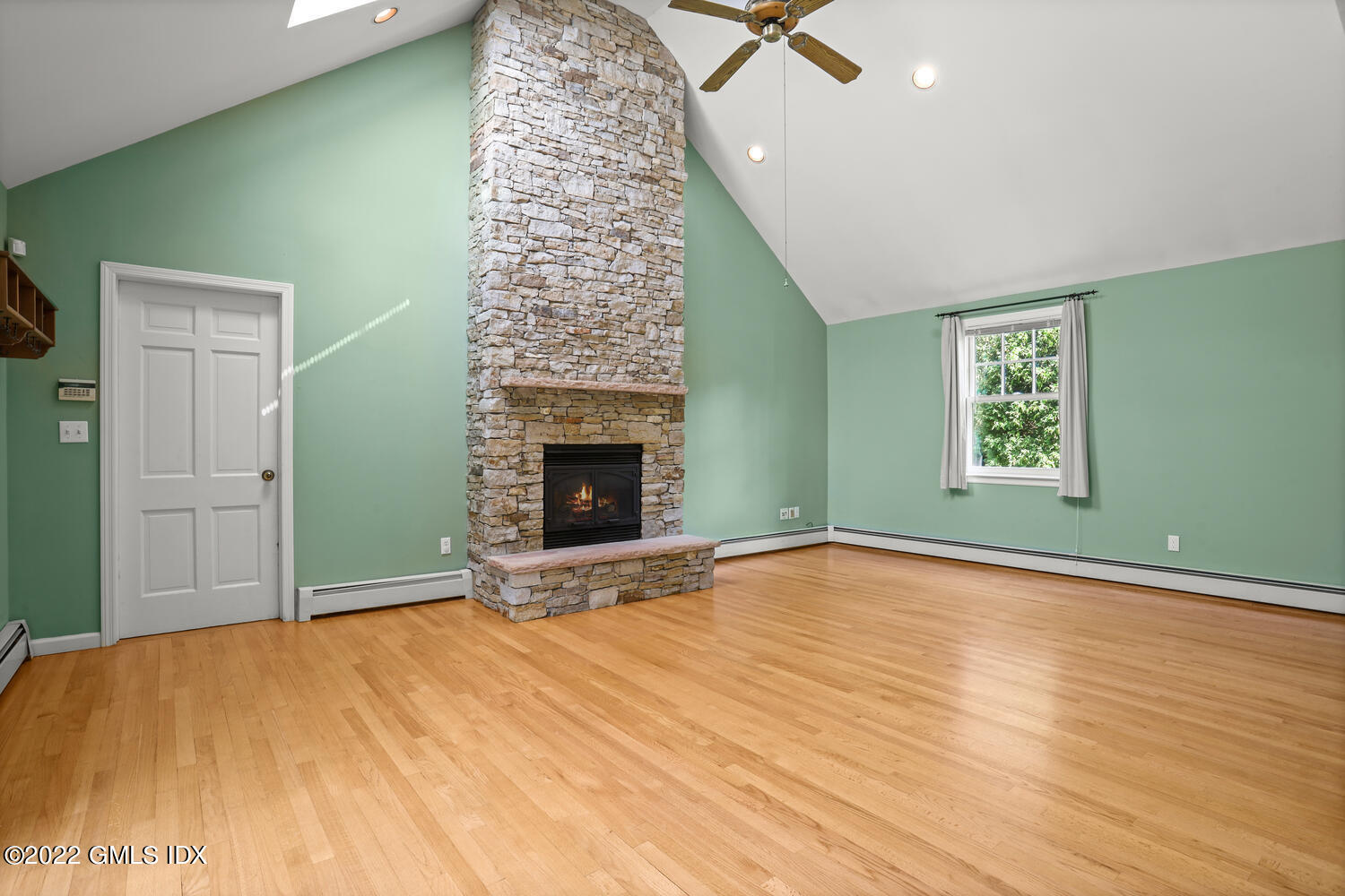 1 Sundance Drive Cos Cob, CT 06807 - Photo 13 of 50 a view of an empty room with window and fire place