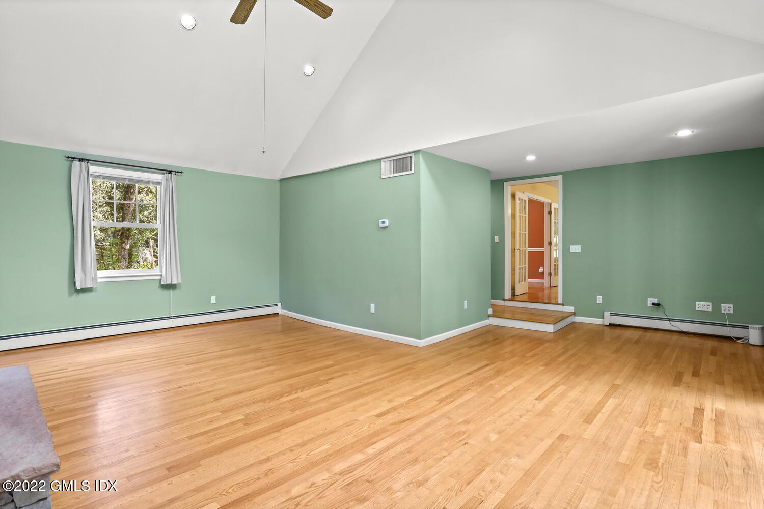 1 Sundance Drive Cos Cob, CT 06807 - Photo 15 of 50 an empty room with wooden floor and windows