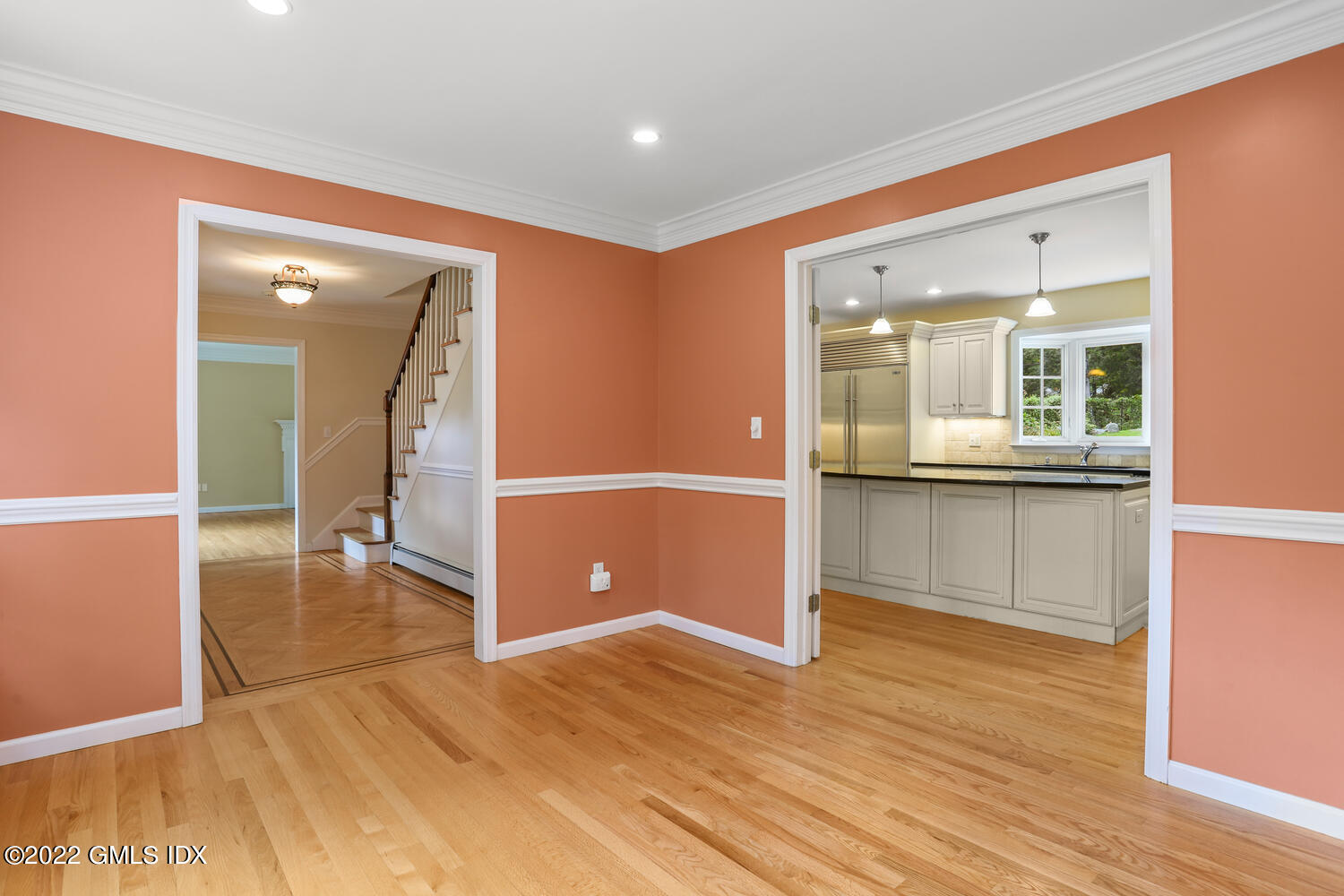 1 Sundance Drive Cos Cob, CT 06807 - Photo 16 of 50 an empty room with wooden floor and windows