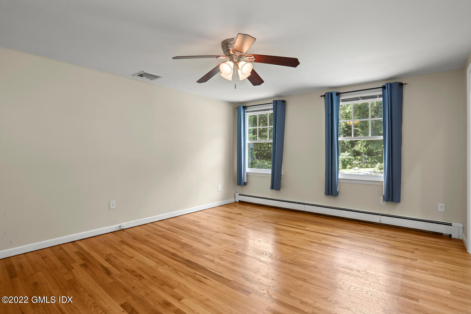 1 Sundance Drive Cos Cob, CT 06807 - Photo 24 of 50 a view of an empty room with wooden floor and a window