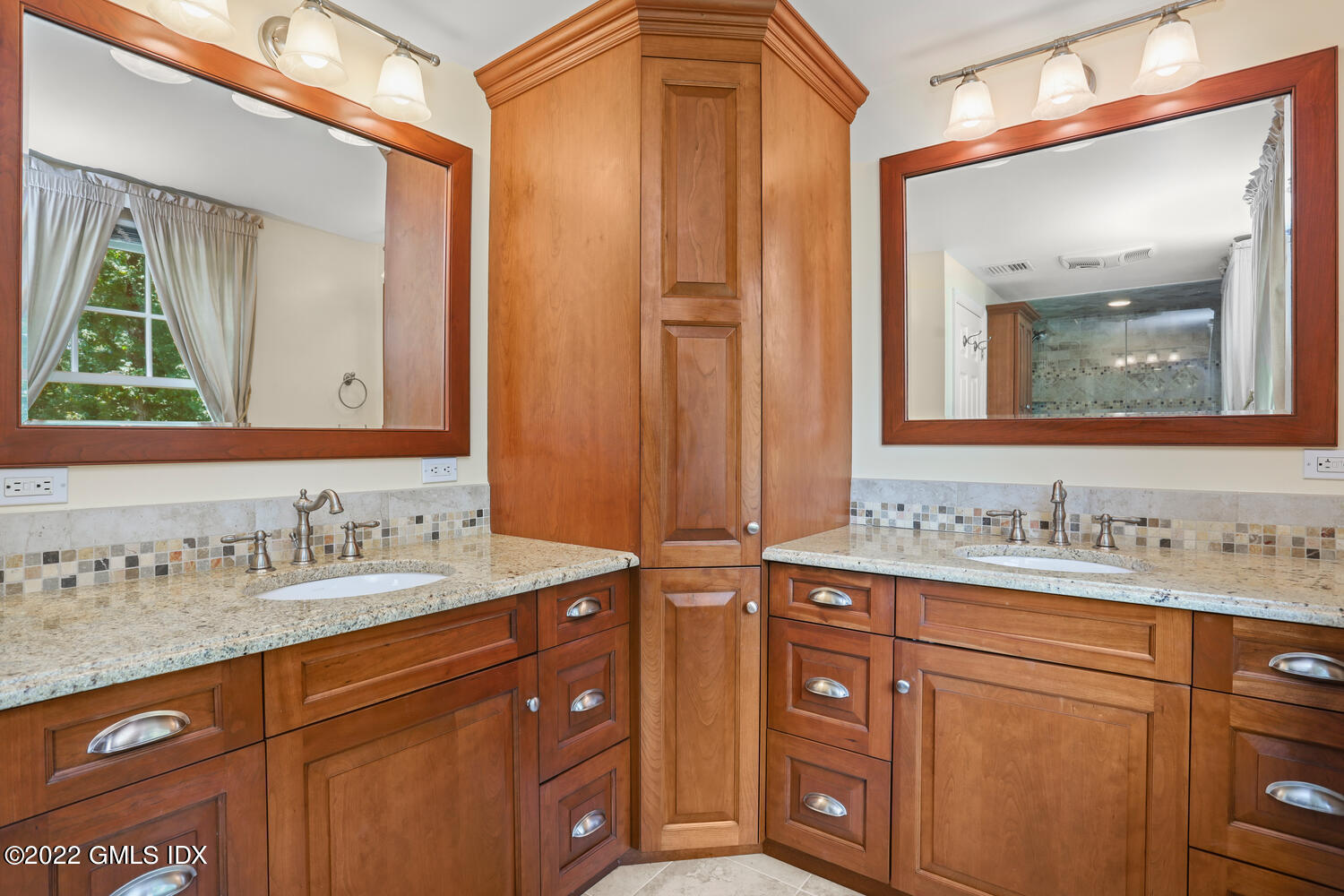 1 Sundance Drive Cos Cob, CT 06807 - Photo 30 of 50 a bathroom with a sink vanity and mirror