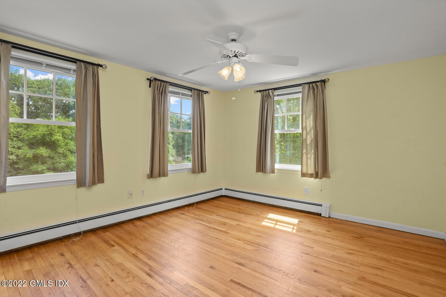 1 Sundance Drive Cos Cob, CT 06807 - Photo 31 of 50 a view of an empty room with wooden floor and a window