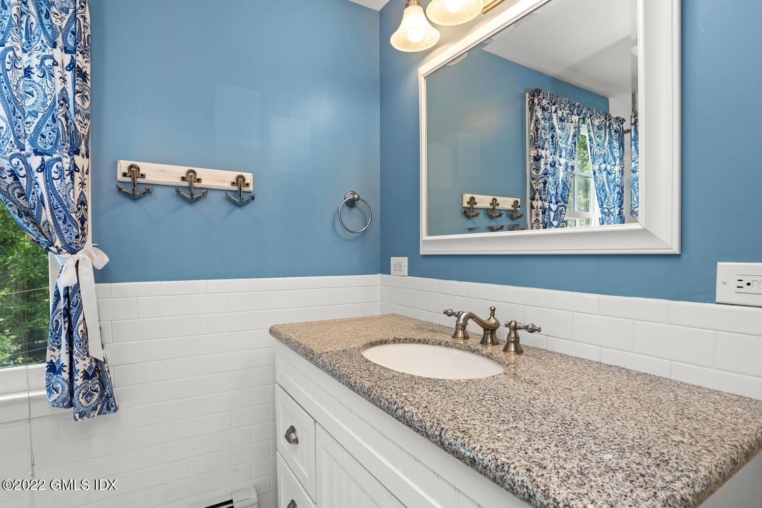 1 Sundance Drive Cos Cob, CT 06807 - Photo 37 of 50 a bathroom with a granite countertop sink and a mirror