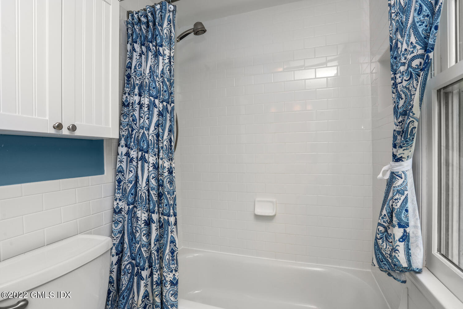 1 Sundance Drive Cos Cob, CT 06807 - Photo 38 of 50 a bathroom with a shower curtain and a toilet