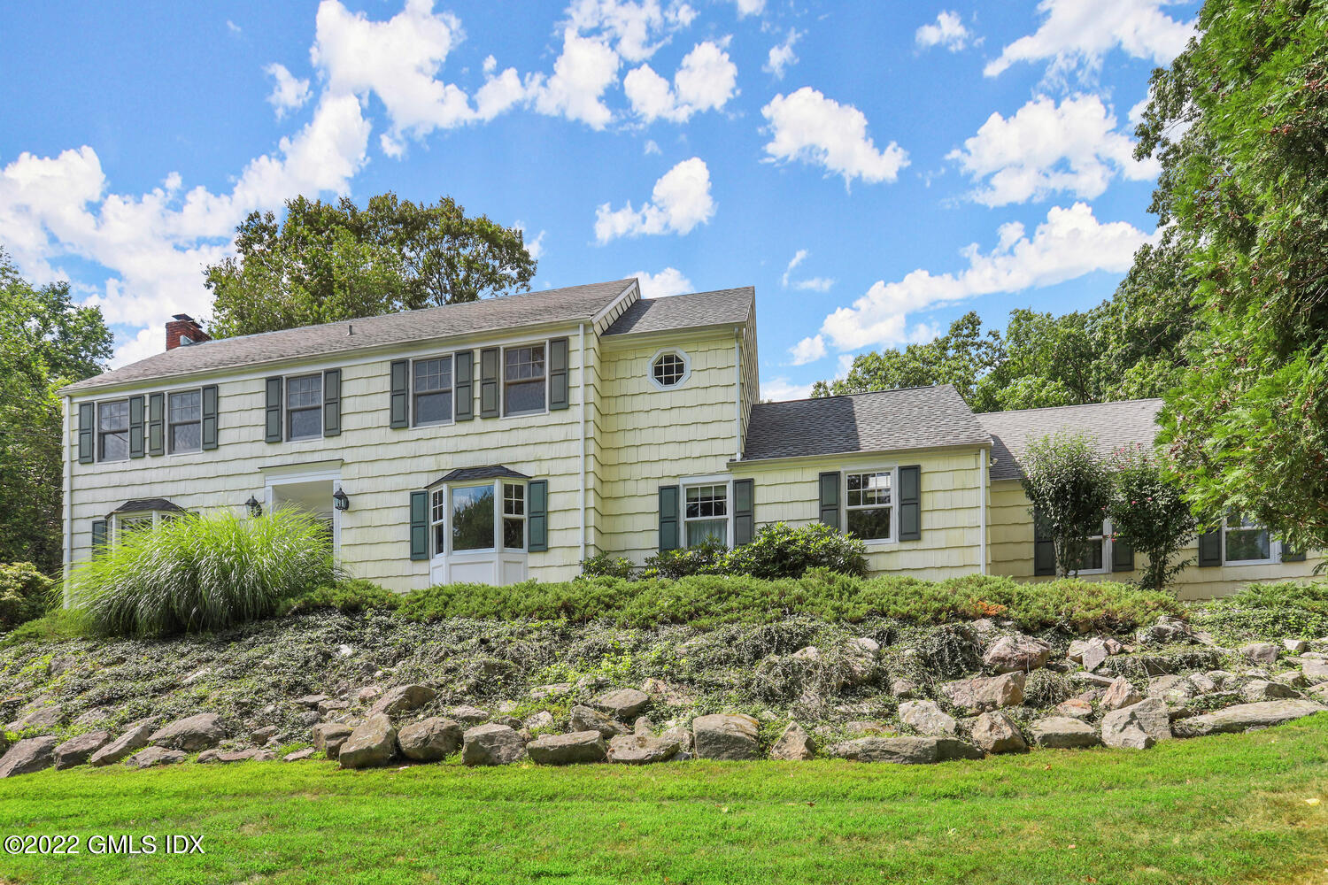 1 Sundance Drive Cos Cob, CT 06807 - Photo 46 of 50 a front view of a house with a garden