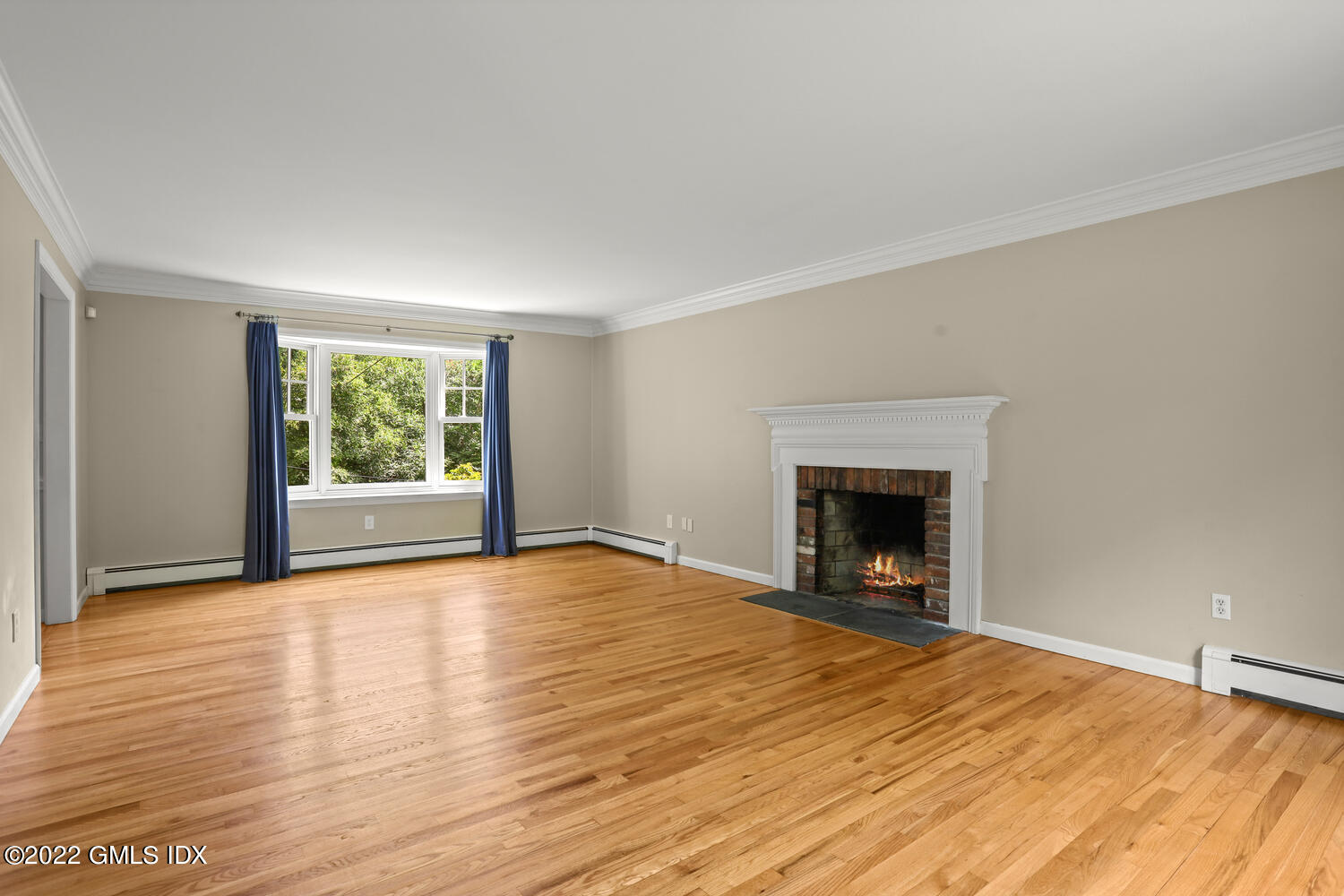 1 Sundance Drive Cos Cob, CT 06807 - Photo 5 of 50 a view of an empty room with wooden floor and a window