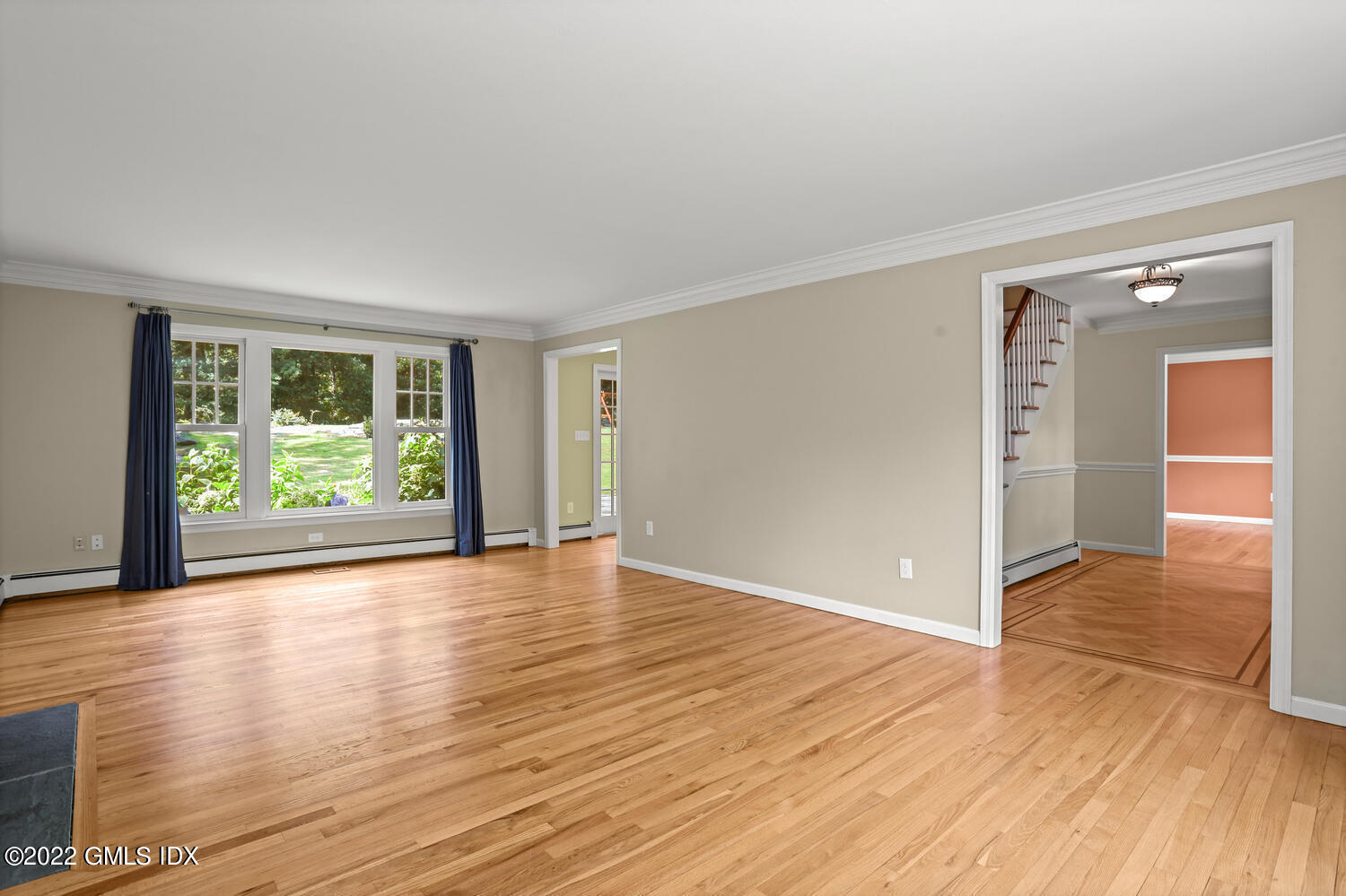 1 Sundance Drive Cos Cob, CT 06807 - Photo 6 of 50 a view of an empty room with wooden floor and a window
