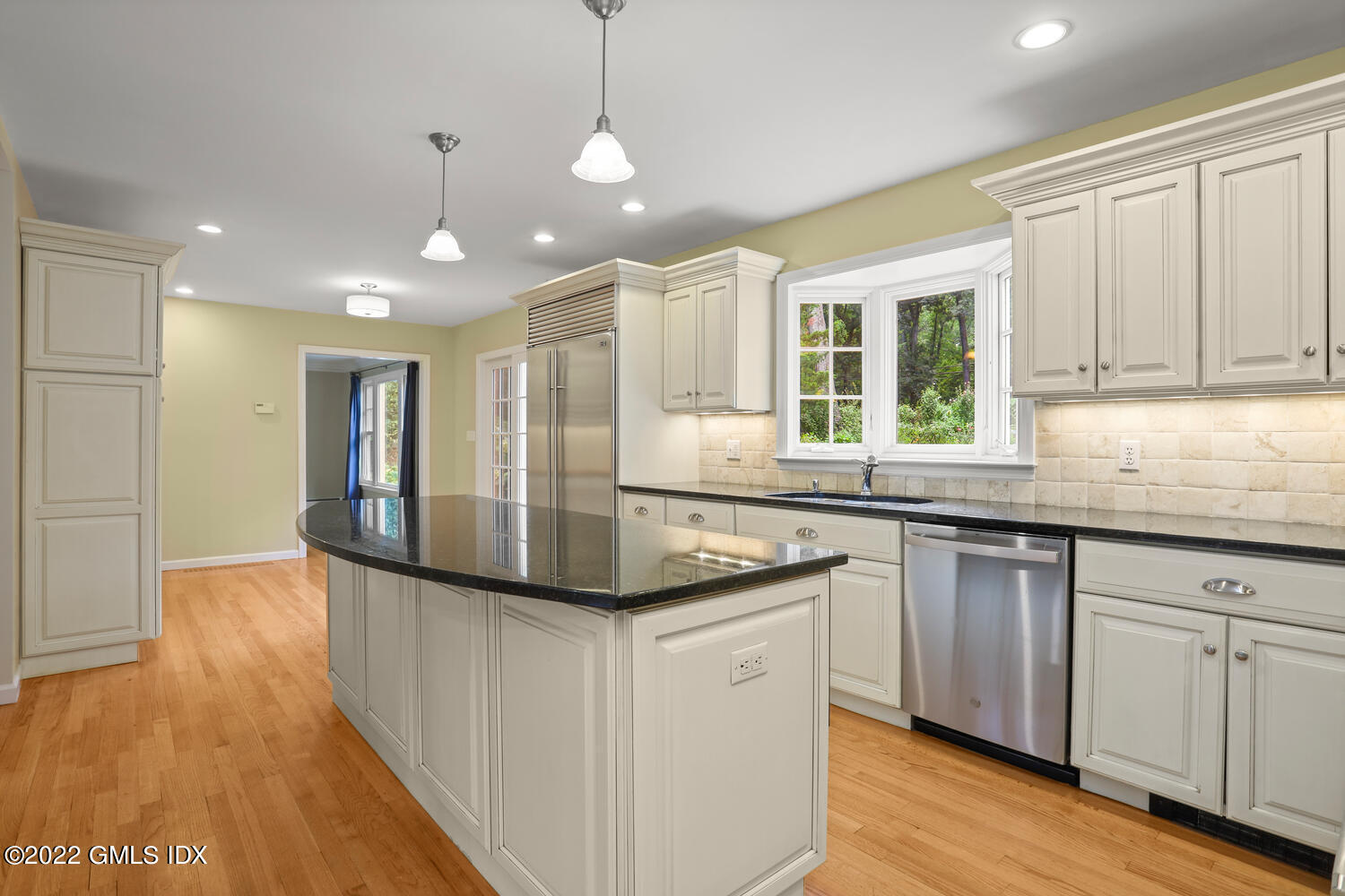 1 Sundance Drive Cos Cob, CT 06807 - Photo 8 of 50 a kitchen with stainless steel appliances granite countertop a sink and a granite counter tops with wooden floors