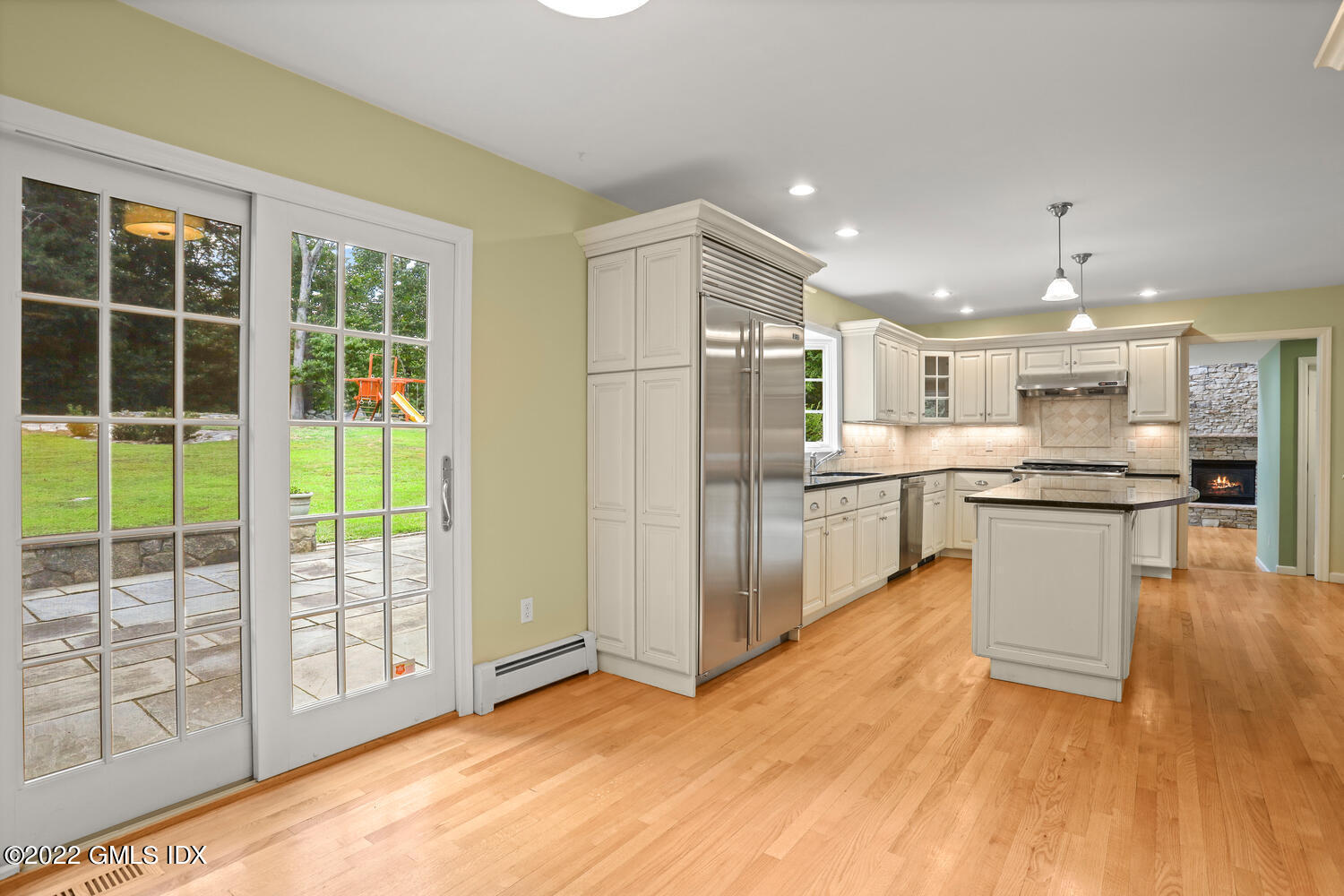 1 Sundance Drive Cos Cob, CT 06807 - Photo 9 of 50 a open kitchen with white cabinets and stainless steel appliances