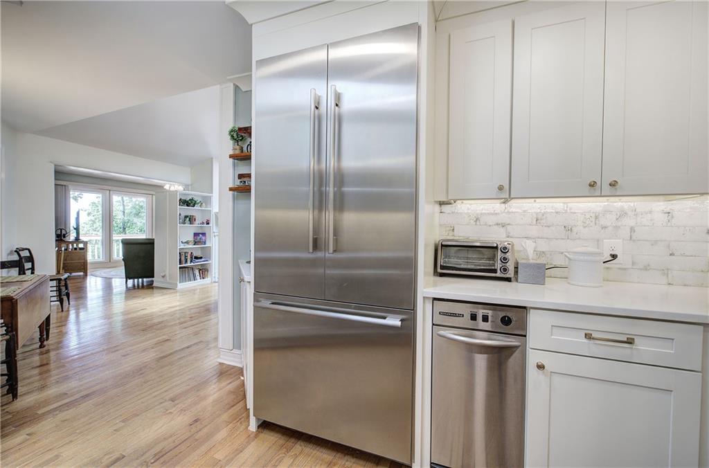 213 South View Trail Jasper, GA 30143 - Photo 18 of 79 a kitchen with granite countertop a refrigerator and a stove top oven