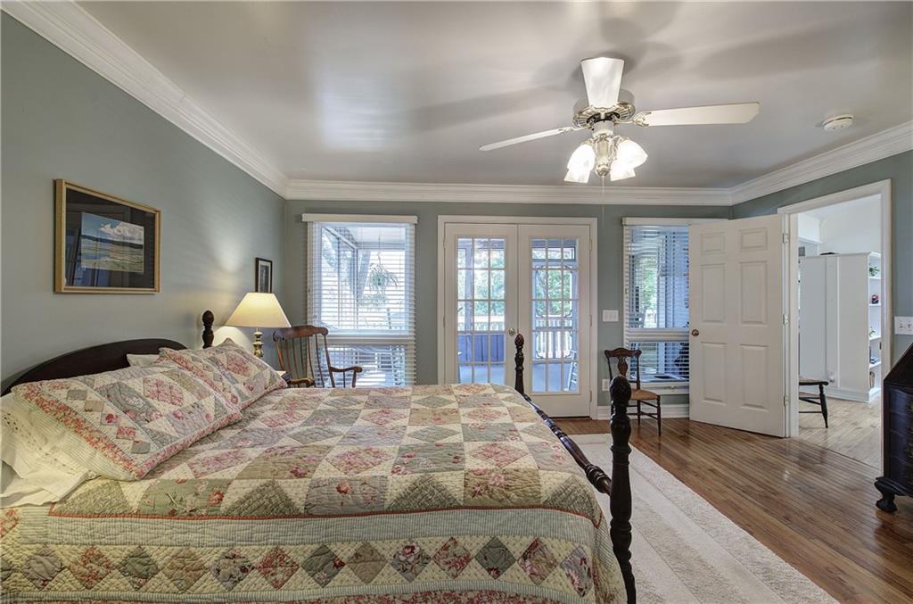 213 South View Trail Jasper, GA 30143 - Photo 23 of 79 a bedroom with a large bed and a chandelier