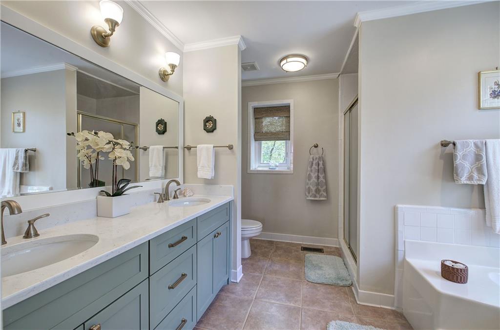 213 South View Trail Jasper, GA 30143 - Photo 26 of 79 a spacious bathroom with a double vanity sink a mirror and a shower